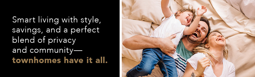 happy couple with a young child in their new home